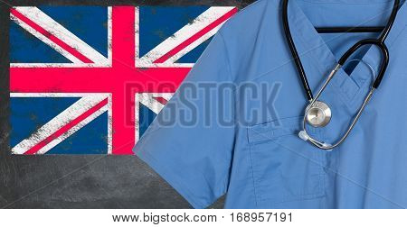 Blue doctor scrubs shirt and stethoscope hang empty in front of British flag. Illustration of medical staff coming from other countries to staff national health service