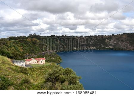 The incredible Blue Lake with the original pumping station at Mt Gambier South Australia. The Blue Lake is a large monomictic crater lake located in a dormant volcanic maar associated with the Mount Gambier maar complex.