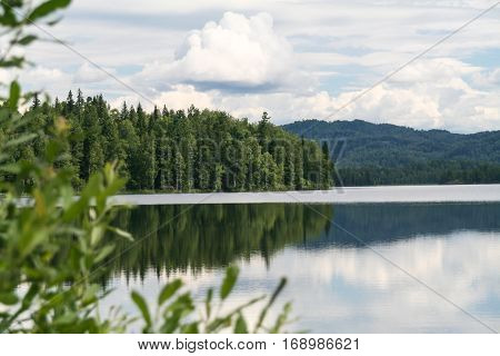 Green cape on lake. Tagasuk lake, Russia
