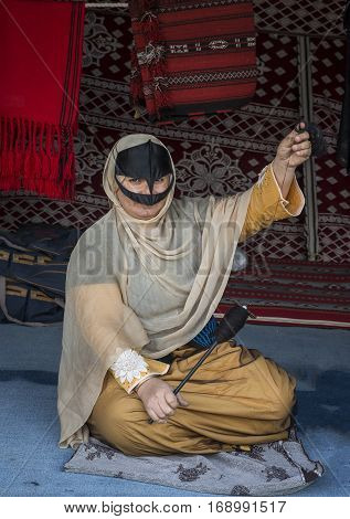 Muscat Oman February 4th 2017: omanya making yarn out of wool