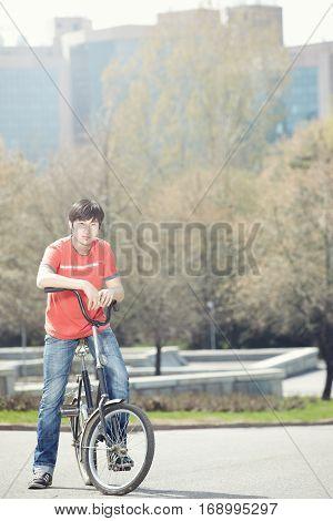 Asiam man standing with biker in the city