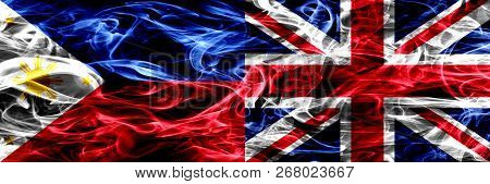 Philippines Vs United Kingdom, British Smoke Flags Placed Side By Side. Thick Abstract Colored Silky