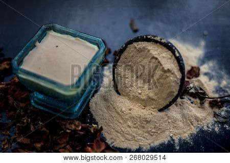 Close Up Of Popular Way Of Ex Foliating On Wooden Surface I.e. Multani  Mitti Or Fuller's Earth Well