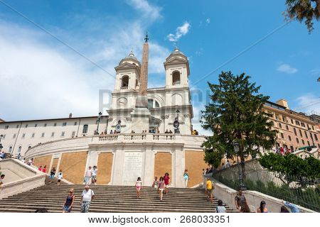 ROME - AUGUST 3: The Spanish Steps, with tourists, seen from Piazza di Spagna on August 3, 2018, Rome.The Spanish Steps are the widest staircase in Europe.