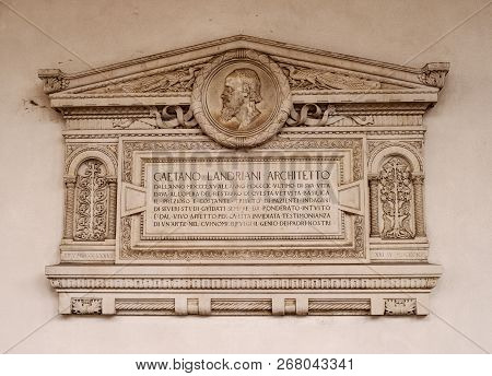 Milan, Italy-09 May 2018: Memorial Plaque On The Wall Of The Basilica Of Santambrogio. In The Church
