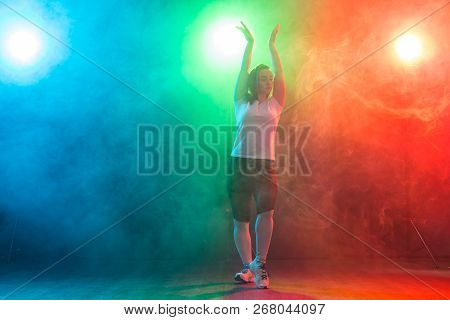 Hip-hop, Jazz-funk, Tecktonik, Waacking, Trance And Street Dances Concept - Young Woman Dancing Jazz
