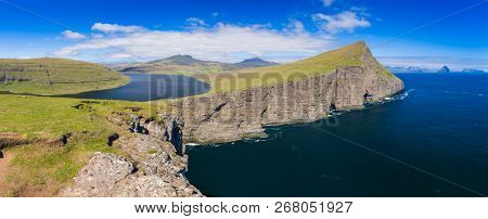 Panoramic View Of The Traelanipan Cliff And Sorvagsvatn Lake at Sunny Day, Vagar, Faroe Islands, Denmark.  - A Lake Above the Ocean