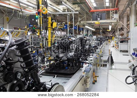 Assembly Of Motor Vehicle. Robotic Equipment Makes Assembly Of Car. Modern Car Assembly At Factory