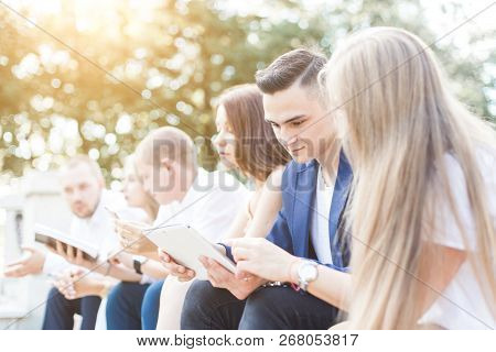 Meeting Of Young People, Team Of Businessmen In Nature. Lifestyle, Young Entrepreneurs