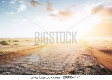 Fantastic Sunset Of The Mountains And Volcanic Lava Sand Dunes To The Beach In Stokksness. The Conce