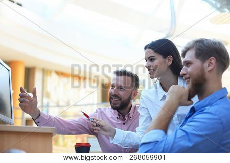 Group Of Young Modern People In Smart Casual Wear Having A Brainstorm Meeting While Standing In The 