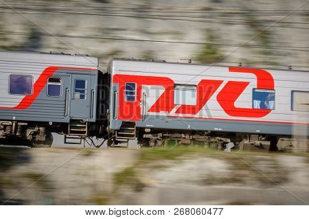 Russia, Krasnodar Krai, Gizele-dere Village,  August 10, 2018: Passenger Wagon Of Train With The Ins