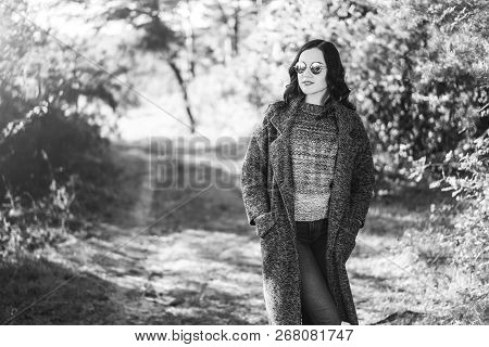 Pretty Long Hair Bruntte Girl Walking In The Autumn Forest.