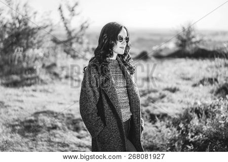 Pretty Long Hair Bruntte Girl Walking In The Autumn Forest.