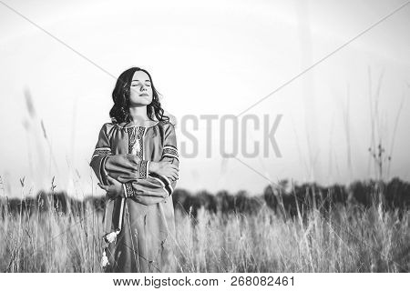 Pretty Young Brunette Girl In Long Embroidery Dress Outdoor