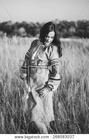 Pretty Young Brunette Girl In Long Embroidery Dress Outdoor