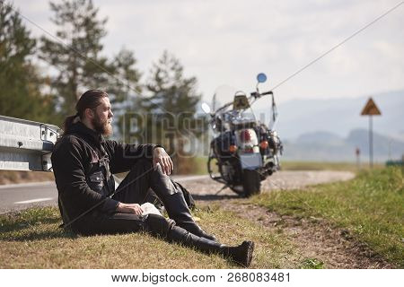 Tall Athletic Sportive Muscular Biker In Black Leather Clothing Sitting At Cruiser Powerful Motorbik