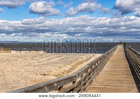 A Long Fishing Pier With Beach Sand Being Replaced In Bayshore Waterfront Park In Monmouth County Nj