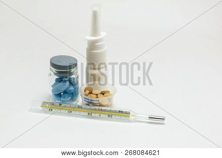 Pill Packaging And Medical Supplies Nasal Spray Mercury Termometer On White Background