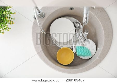 Heap Of Dirty Dishes In Kitchen Sink, Top View. Cleaning Chores