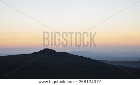 Beautiful Sunset Silhouette Landscape Image Of Foggintor In Dartmoor