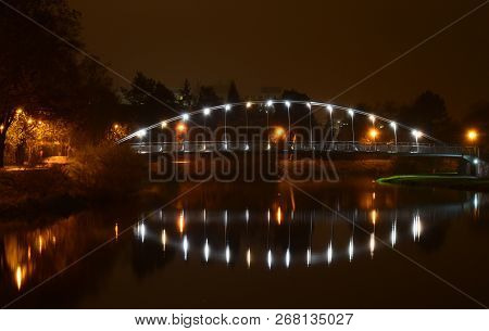 Night View Of Emil Pitter Footbridge For Pedestrians And Cyclists Across The Vltava River In Ceske B