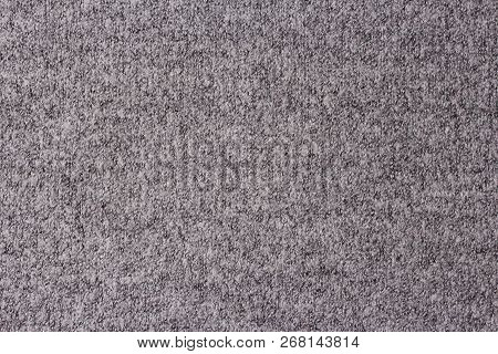 Background Of Grey Knitted Fabric. Home Made Stitchwork.