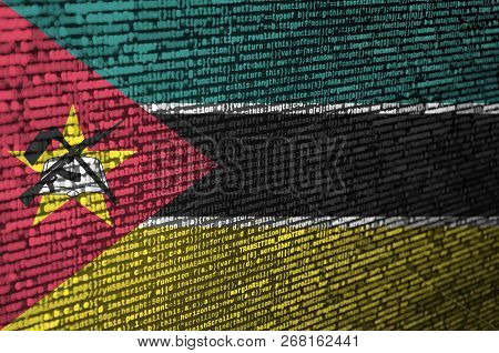 Mozambique Flag  Is Depicted On The Screen With The Program Code. The Concept Of Modern Technology A