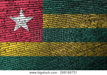 Togo Flag  Is Depicted On The Screen With The Program Code. The Concept Of Modern Technology And Sit