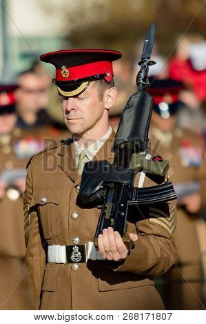 Sandhurst, United Kingdom, 11th November 2018:- A British Soldier Stands Guard At Sandhurst War Memo