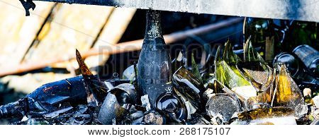 Close Up Damaged Supermarket Glass Plastic Bottles After Arson Fire With Burn Black Dark Debris Afte