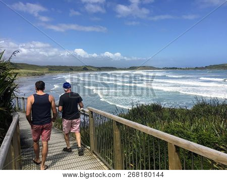 Cape Foulwind, New Zealand - February 10th, 2016: A Father And Son Tourist Pair On The Cape Foulwind