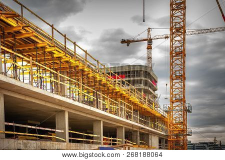 Construction Site. Crane And Monolite House. Building New House