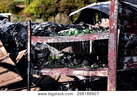 Close Up Damaged Supermarket Glass Plastic Bottles After Arson Fire With Burn Black Dark Debris Afte