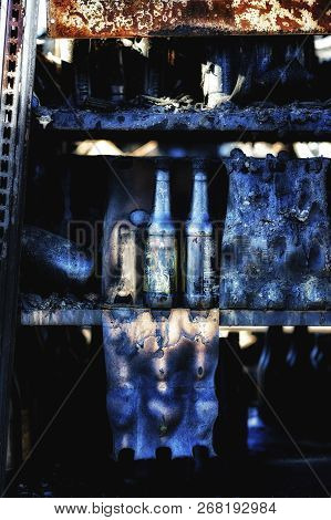 Close Up Damaged Supermarket Glass Plastic Bottles After Arson Fire With Burn Black Dark Debris Afte
