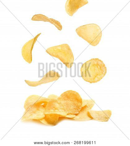 Tasty Potato Chips Falling On White Background