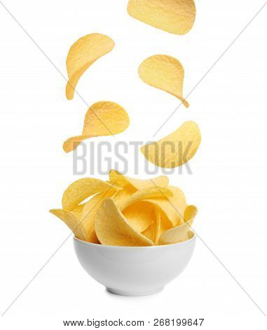Tasty Potato Chips Falling Into Blow On White Background