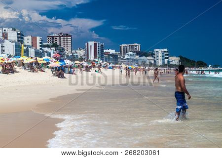 Rio De Janeiro, Brazil - January 27, 2015: People Enjoy The Famous Beach Ipanema In Rio De Janeiro.