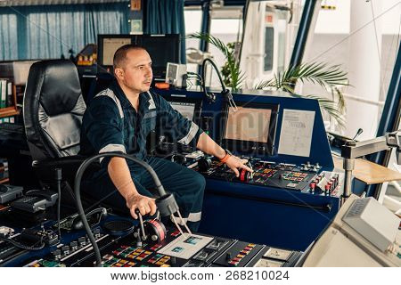 Marine Navigational Officer Is Maneuvering Ship Or Vessel