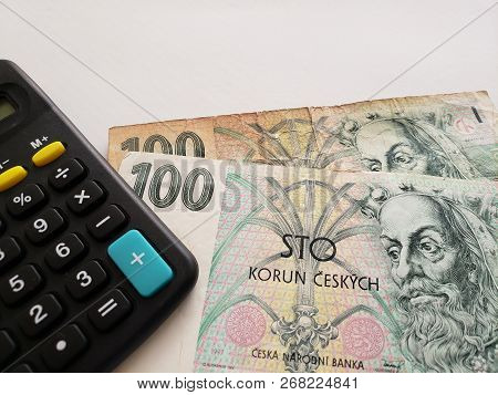 Czech Banknotes Of 100 Korun And Calculator On The Table