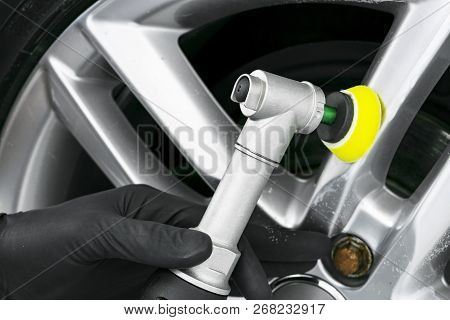 Car Polish Wax Worker Hands Polishing Car Whell. Buffing And Polishing Car Disk. Car Detailing. Man 