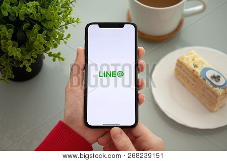 Alushta, Russia - November 6, 2018: Woman Hand Holding Iphone X With Social Networking Service Line 