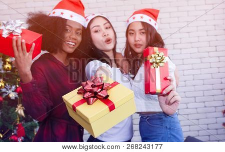 Christmas And Happiness Concept - Smiling Sandy Girl Holding Many Gift Boxes.