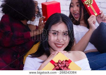 Christmas And Happiness Concept - Smiling Sandy Girl Holding Many Gift Boxes.