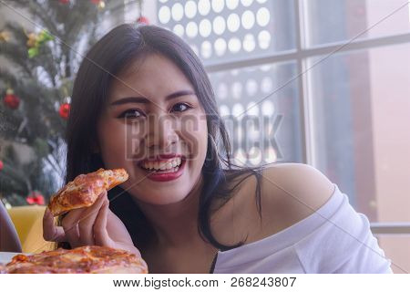Friendship Enjoy Eating Pizza On A Table.