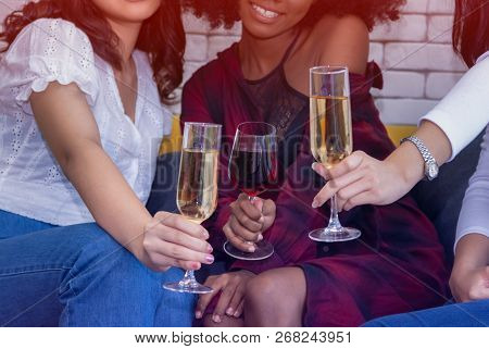 Closeup Photo Of Cheerful Girls Celebrating A Party At Home With Campaign.