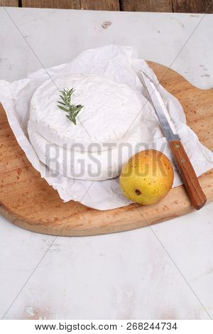 Camembert With Pear On A White Background. Camembert Cheese