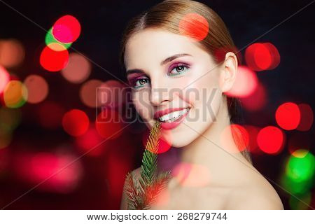 Young Happy Woman With Makeup Smiling On Celeration Sparkle Background