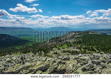 The Rocky Slope And Mountain Valleys On A Cloudy Day