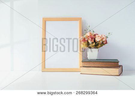 Mock Up Portrait Photo Frame With Green Plant On Table, Home Decoration.